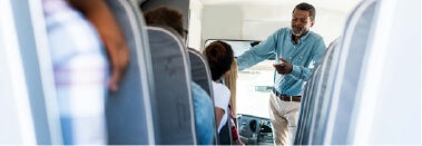 students and a teacher on a school bus